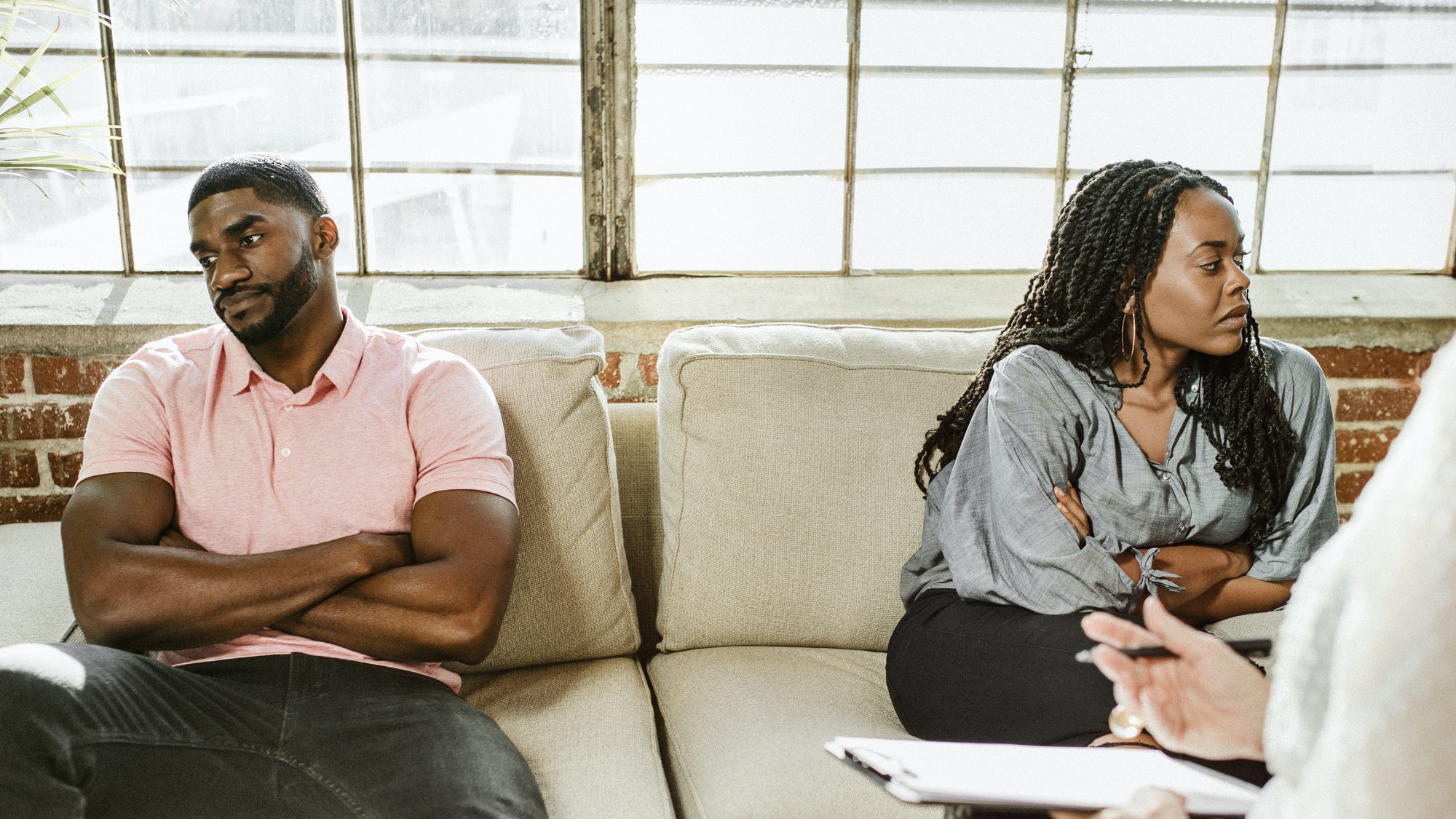 couple sulking during Marriage Counseling session