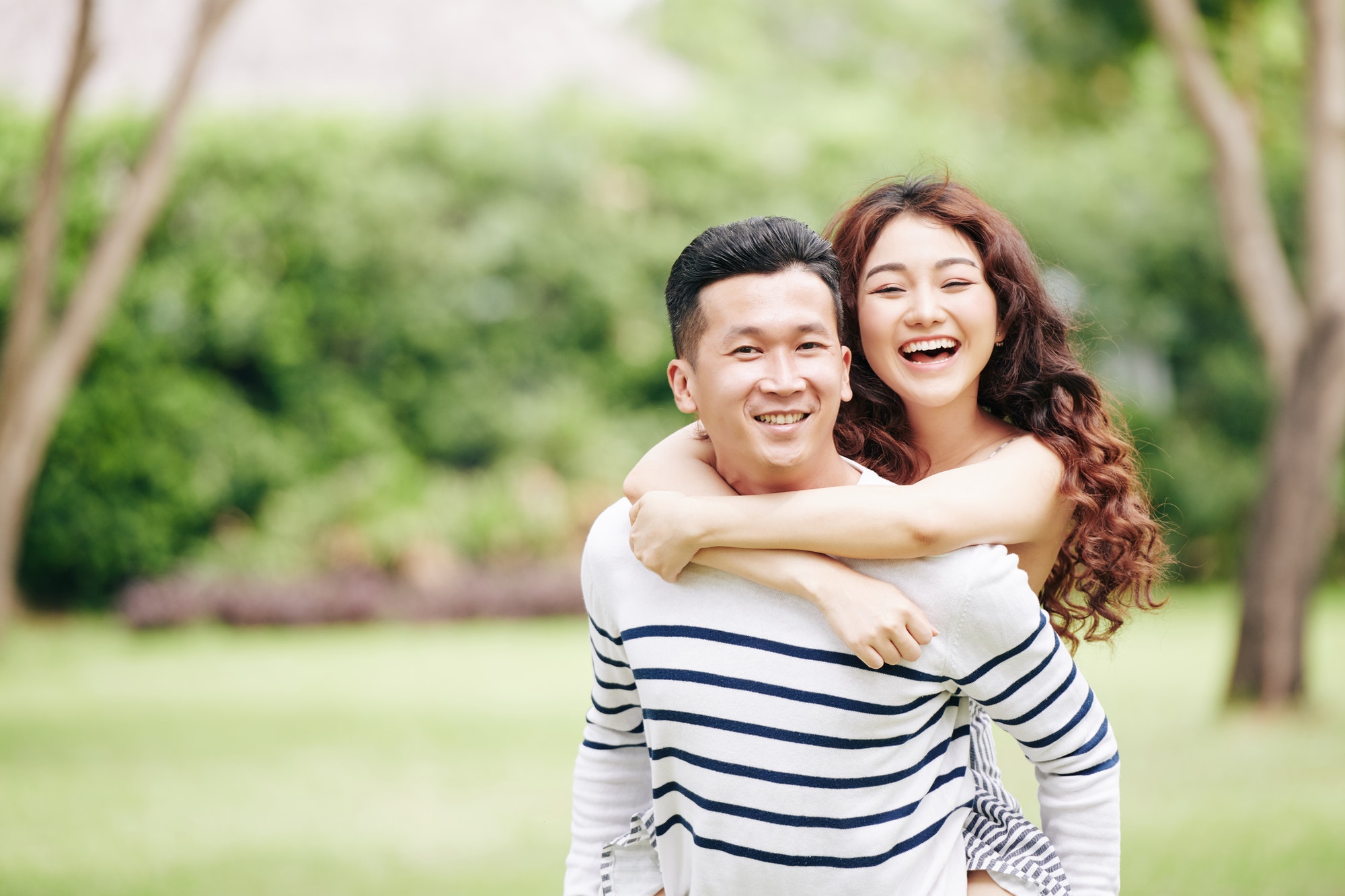 Happy couple in park after marriage counseling 